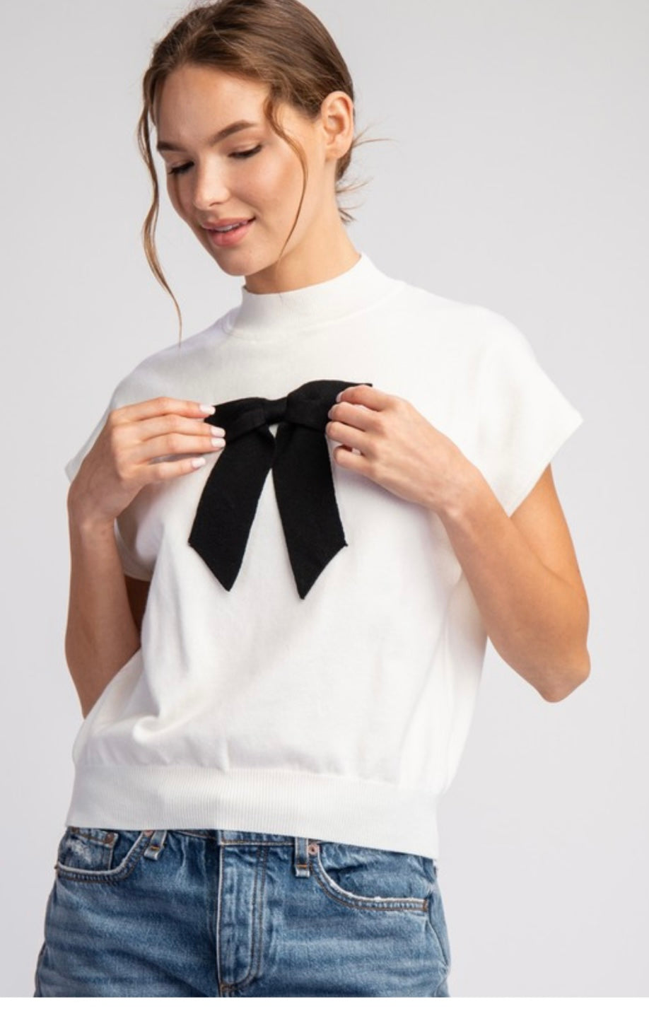 Ivory Mock Neck Line Sweater With Black Bow