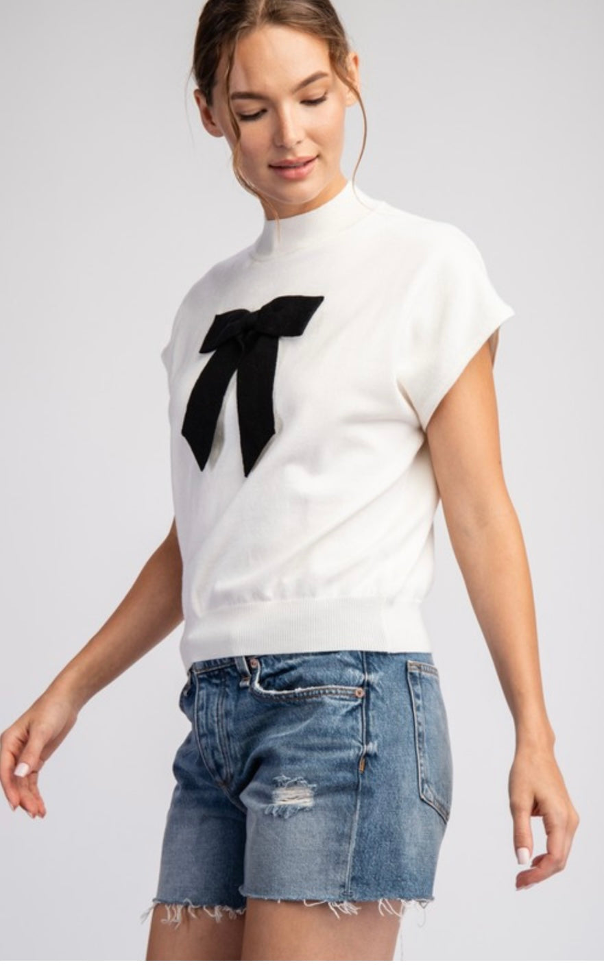 Ivory Mock Neck Line Sweater With Black Bow